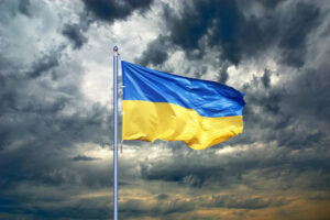 Ukraine flag 300x200 - Ukraine flag. Ukrainian flag on black storm cloud sky. stormy weather